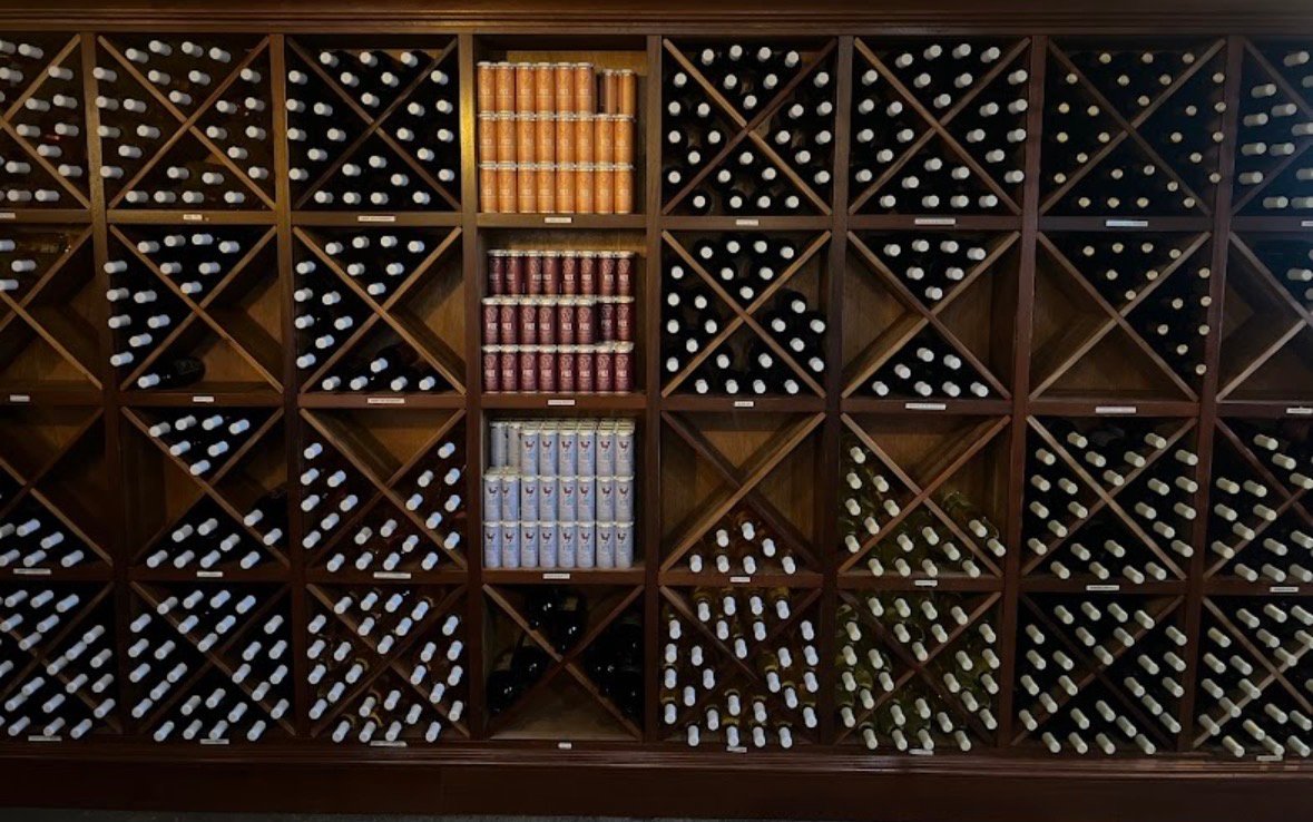 Wine Bottles and various colors in vineyard wedding at Vineyard Estates at Valenzanos Winery.