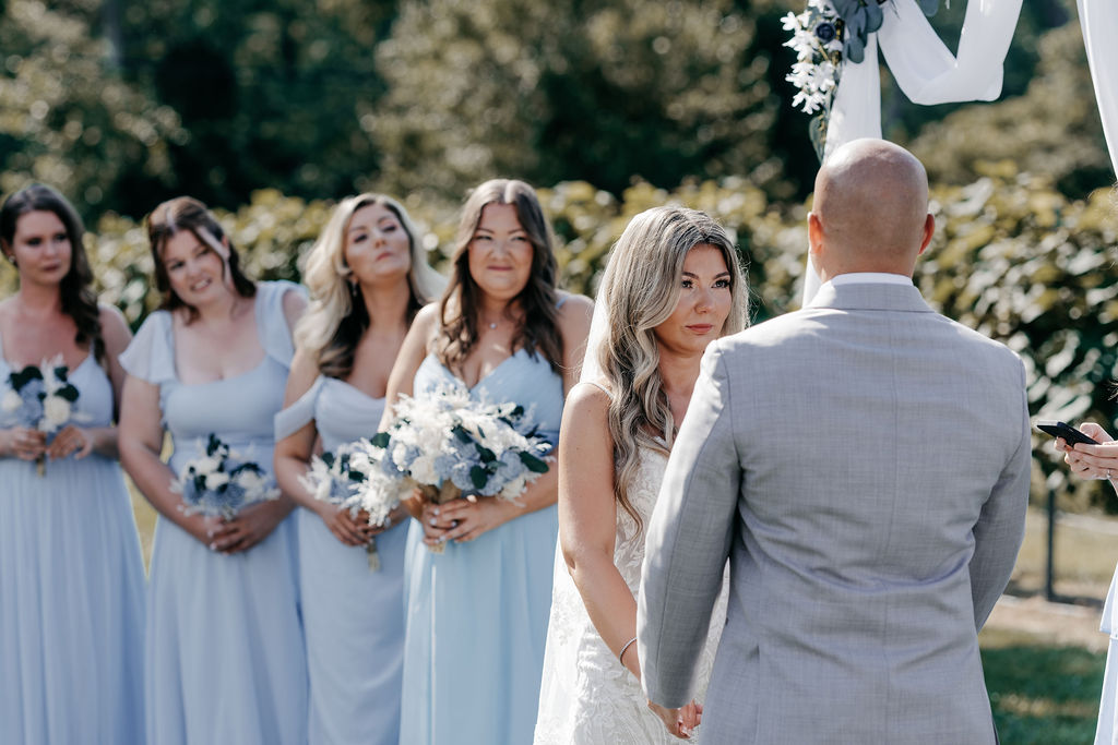 Bride and groom at ceremony in vineyards of Valenzanos Winery