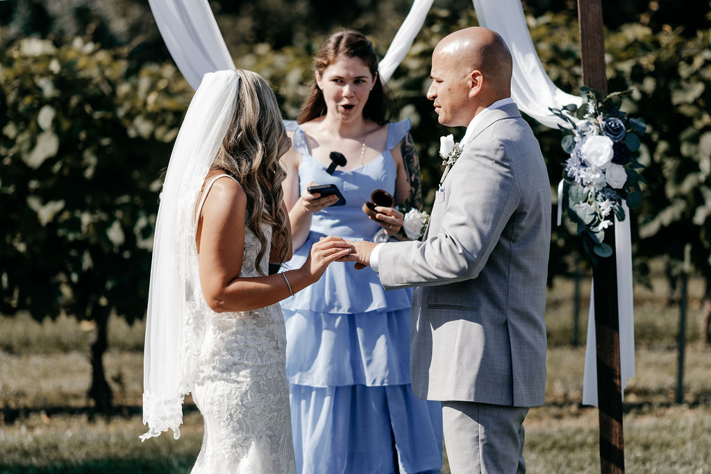 wedding ceremony with the couple in the vineyards at Valenzanos Family Winery